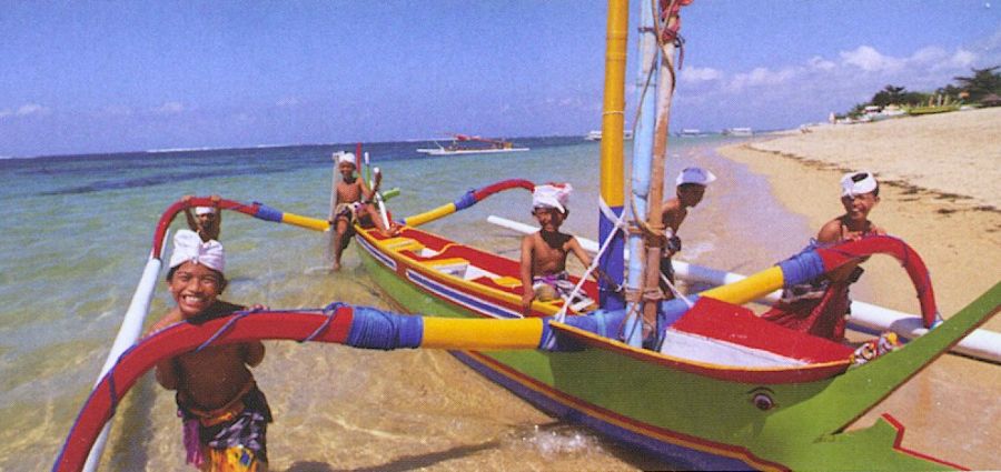 Fishermen and fishing boat on the Indonesian Island of Bali